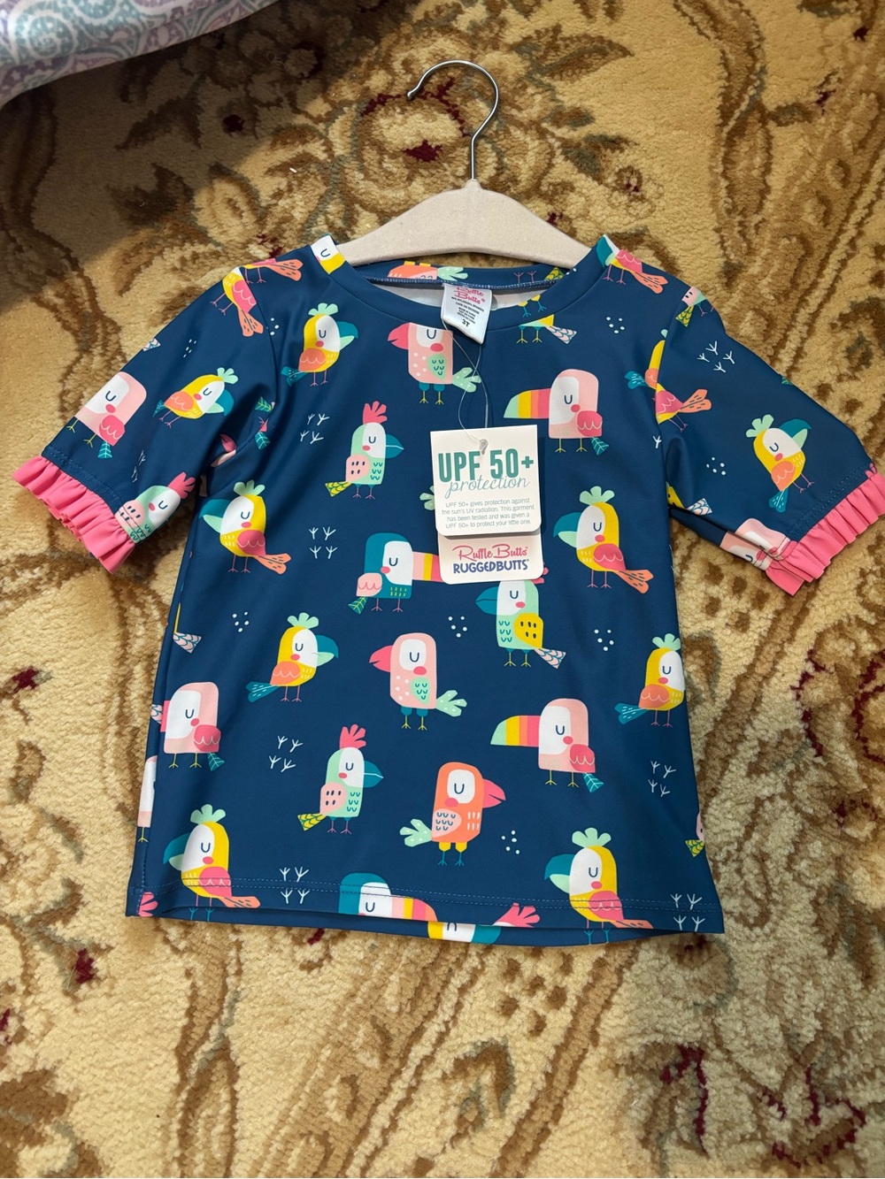 RuffleButts Ruggabuts UPF 50+ Bird Print Swim Shirt - Navy with Multicolor Birds